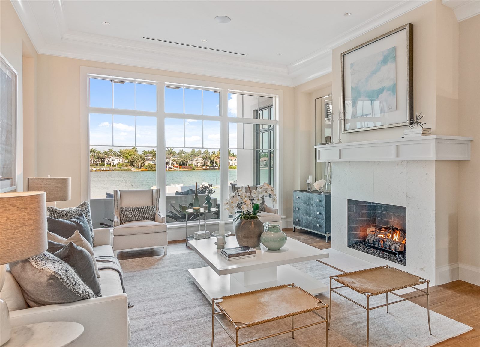 Living room with fireplace looking out over the water, South Florida